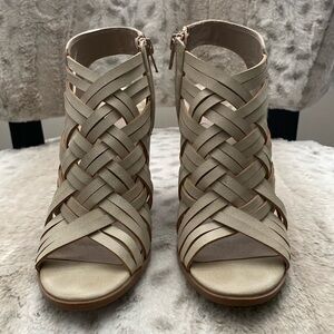 Creative leather design open toe and heel ankle boots.